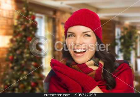 To use this stock image in your creative project, please select the size you need over to the right and click the "Add to Cart" button.
Your downloaded image will come with the Cutcaster watermark removed so don’t worry about the watermark you see on this page. Mixed Race Woman Wearing Mittens and Hat In Christmas Setting stock photo, Happy Mixed Race Woman Wearing Mittens and Hat In Christmas Setting. by Andy Dean