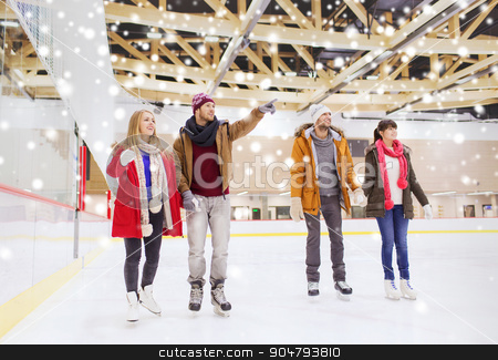 To use this stock image in your creative project, please select the size you need over to the right and click the "Add to Cart" button.
Your downloaded image will come with the Cutcaster watermark removed so don’t worry about the watermark you see on this page. happy friends pointing finger on skating rink stock photo, people, friendship, sport, gesture and leisure concept - happy friends pointing finger on skating rink by Syda Productions