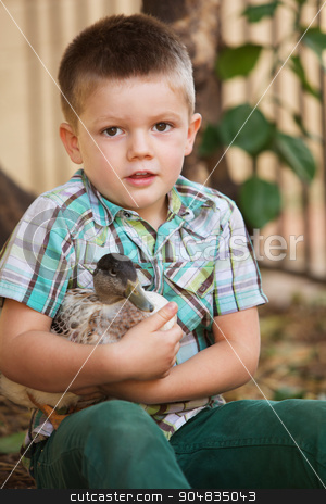 To use this stock image in your creative project, please select the size you need over to the right and click the "Add to Cart" button.
Your downloaded image will come with the Cutcaster watermark removed so don’t worry about the watermark you see on this page. Cute Child Holding Duck stock photo, Single smiling child holding a duck outdoors by Scott Griessel