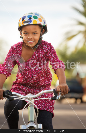 To use this stock image in your creative project, please select the size you need over to the right and click the "Add to Cart" button.
Your downloaded image will come with the Cutcaster watermark removed so don’t worry about the watermark you see on this page. Happy Girl Riding Bike stock photo, Happy African American girl in helmet riding bike by Scott Griessel