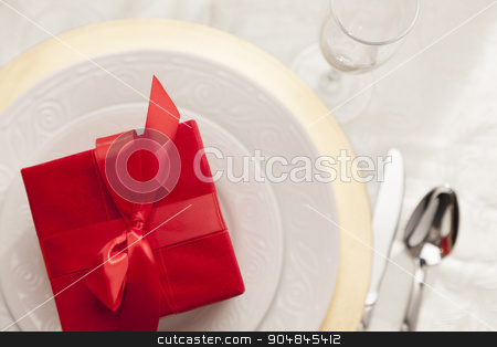 To use this stock image in your creative project, please select the size you need over to the right and click the "Add to Cart" button.
Your downloaded image will come with the Cutcaster watermark removed so don’t worry about the watermark you see on this page. Christmas Gift with Place Setting at Table stock photo, Beautiful Christmas Gift with Place Setting Abstract at Table. by Andy Dean