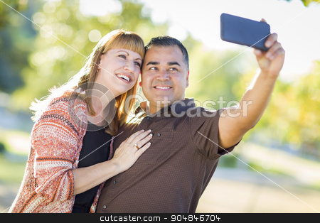 To use this stock image in your creative project, please select the size you need over to the right and click the "Add to Cart" button.
Your downloaded image will come with the Cutcaster watermark removed so don’t worry about the watermark you see on this page. Attractive Mixed Race Couple Taking Self Portraits stock photo, Attractive Mixed Race Couple Taking Self Portraits in the Park. by Andy Dean