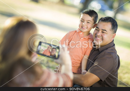 To use this stock image in your creative project, please select the size you need over to the right and click the "Add to Cart" button.
Your downloaded image will come with the Cutcaster watermark removed so don’t worry about the watermark you see on this page. Mixed Race Family Taking A Phone Camera Picture stock photo, Happy Mixed Race Family Taking A Phone Camera Picture At The Park. by Andy Dean
