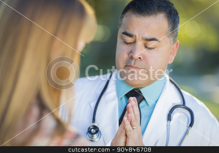 To use this stock image in your creative project, please select the size you need over to the right and click the "Add to Cart" button.
Your downloaded image will come with the Cutcaster watermark removed so don’t worry about the watermark you see on this page. Hispanic Male Doctor Praying With A Patient stock photo, Hispanic Male Doctor Or Nurse Praying With A Patient Outdoors. by Andy Dean