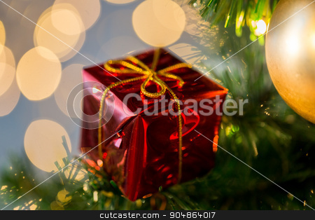 To use this stock image in your creative project, please select the size you need over to the right and click the "Add to Cart" button.
Your downloaded image will come with the Cutcaster watermark removed so don’t worry about the watermark you see on this page. close up of gift box decoration on christmas tree stock photo, holidays, new year, decor and celebration concept - close up of red gift box decoration on christmas tree by Syda Productions