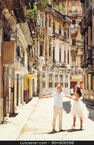 To use this stock image in your creative project, please select the size you need over to the right and click the "Add to Cart" button.
Your downloaded image will come with the Cutcaster watermark removed so don’t worry about the watermark you see on this page. Happy couple in old city of Havana stock photo, Happy couple in old city of Havana by Volodymyr Ivash
