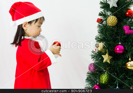 To use this stock image in your creative project, please select the size you need over to the right and click the "Add to Cart" button.
Your downloaded image will come with the Cutcaster watermark removed so don’t worry about the watermark you see on this page. Asian Chinese little girl posing with Christmas Tree stock photo, Asian Chinese little girl posing with Christmas Tree on plain white background studio. by Tan Kian Khoon