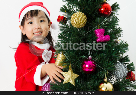 To use this stock image in your creative project, please select the size you need over to the right and click the "Add to Cart" button.
Your downloaded image will come with the Cutcaster watermark removed so don’t worry about the watermark you see on this page. Asian Chinese little girl posing with Christmas Tree stock photo, Asian Chinese little girl posing with Christmas Tree on plain white background studio. by Tan Kian Khoon