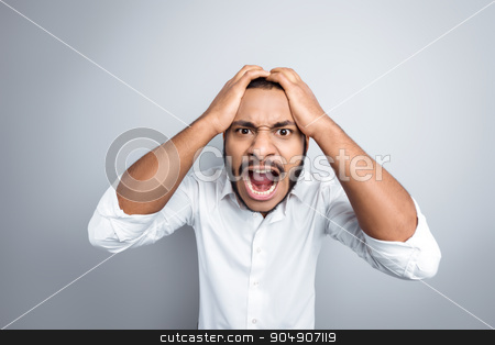To use this stock image in your creative project, please select the size you need over to the right and click the "Add to Cart" button.
Your downloaded image will come with the Cutcaster watermark removed so don’t worry about the watermark you see on this page. Freestyle photo with young mulatto stock photo, Young mixed race man with beard standing on grey background. Angry young man screaming at camera by Dmytro Sidelnikov