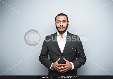 To use this stock image in your creative project, please select the size you need over to the right and click the "Add to Cart" button.
Your downloaded image will come with the Cutcaster watermark removed so don’t worry about the watermark you see on this page. Freestyle photo with young mulatto stock photo, Young mixed race businessman with beard and suit standing on grey background. Young man looking at camera by Dmytro Sidelnikov