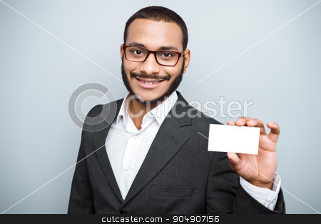 To use this stock image in your creative project, please select the size you need over to the right and click the "Add to Cart" button.
Your downloaded image will come with the Cutcaster watermark removed so don’t worry about the watermark you see on this page. Freestyle photo with young mulatto stock photo, Young mixed race businessman with beard and suit standing on grey background. Young man smiling and holding visit card by Dmytro Sidelnikov