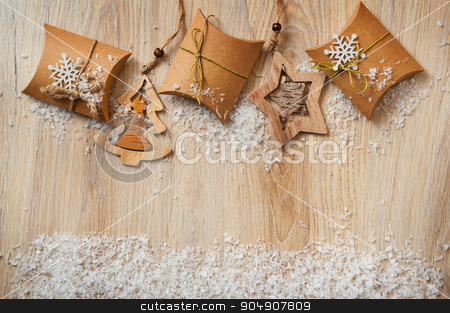 To use this stock image in your creative project, please select the size you need over to the right and click the "Add to Cart" button.
Your downloaded image will come with the Cutcaster watermark removed so don’t worry about the watermark you see on this page. Christmas gifts in kraft paper with a homemade toys with snow stock photo, Christmas gifts in kraft paper with a homemade toys with snow. by timonko