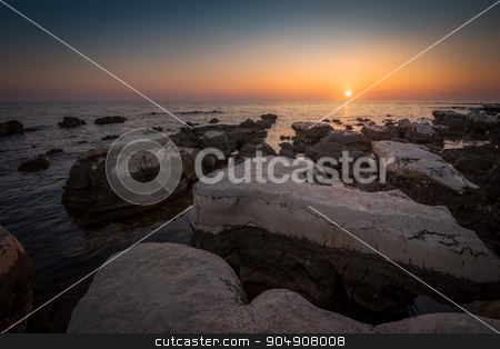 To use this stock image in your creative project, please select the size you need over to the right and click the "Add to Cart" button.
Your downloaded image will come with the Cutcaster watermark removed so don’t worry about the watermark you see on this page. Sunset Over the Sea stock photo, Sunset Over the Sea with Rocks in Foreground by Karol Czinege