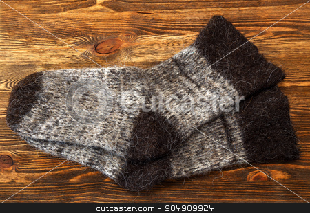 To use this stock image in your creative project, please select the size you need over to the right and click the "Add to Cart" button.
Your downloaded image will come with the Cutcaster watermark removed so don’t worry about the watermark you see on this page. Knitted wool socks stock photo, Knitted wool socks on a brown wooden background by ires007