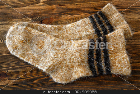 To use this stock image in your creative project, please select the size you need over to the right and click the "Add to Cart" button.
Your downloaded image will come with the Cutcaster watermark removed so don’t worry about the watermark you see on this page. Knitted wool socks stock photo, Knitted wool socks on a brown wooden background by ires007