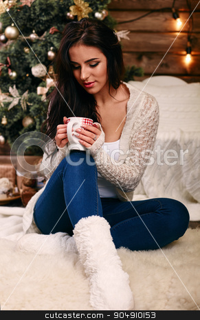 To use this stock image in your creative project, please select the size you need over to the right and click the "Add to Cart" button.
Your downloaded image will come with the Cutcaster watermark removed so don’t worry about the watermark you see on this page. Woman holding a red cup of hot drink. Drink hot tea or coffee in the morning cool. Traditional autumn or winter warming drin stock photo, Woman holding a red cup of hot drink. Drink hot tea or coffee in the morning cool. by mykhalets