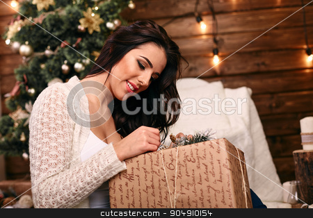 To use this stock image in your creative project, please select the size you need over to the right and click the "Add to Cart" button.
Your downloaded image will come with the Cutcaster watermark removed so don’t worry about the watermark you see on this page. happy young woman opening christmas gift near christmas tree stock photo, happy young woman opening christmas gift near christmas tree by mykhalets