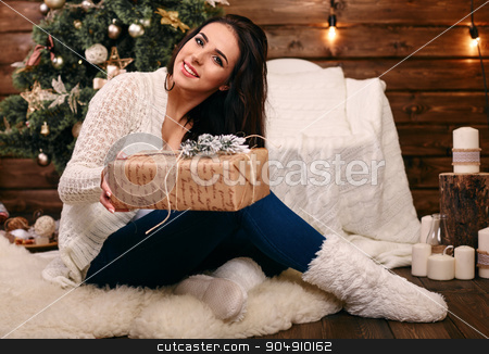 To use this stock image in your creative project, please select the size you need over to the right and click the "Add to Cart" button.
Your downloaded image will come with the Cutcaster watermark removed so don’t worry about the watermark you see on this page. Happy young woman giving christmas present box stock photo, Happy young woman giving christmas present box by mykhalets