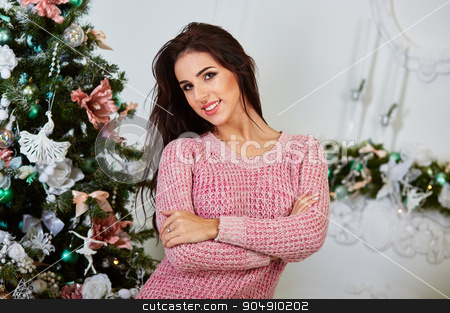 To use this stock image in your creative project, please select the size you need over to the right and click the "Add to Cart" button.
Your downloaded image will come with the Cutcaster watermark removed so don’t worry about the watermark you see on this page. Portrait of smiling young woman near christmas tree stock photo, Portrait of smiling young woman near christmas tree by mykhalets