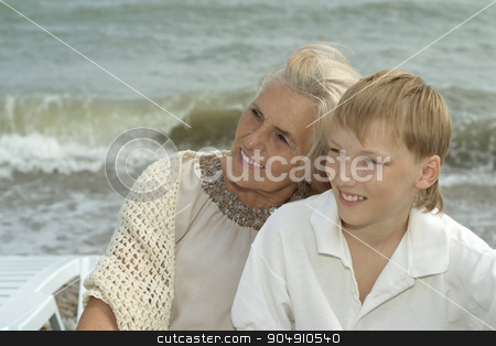 To use this stock image in your creative project, please select the size you need over to the right and click the "Add to Cart" button.
Your downloaded image will come with the Cutcaster watermark removed so don’t worry about the watermark you see on this page. elderly woman with grandson on beach stock photo, Portrait of a happy elderly woman with grandson on beach by Ruslan Huzau