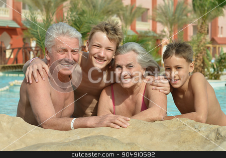To use this stock image in your creative project, please select the size you need over to the right and click the "Add to Cart" button.
Your downloaded image will come with the Cutcaster watermark removed so don’t worry about the watermark you see on this page. Happy Elderly couple with grandsons stock photo, Happy Elderly couple resting at pool together with grandsons by Ruslan Huzau