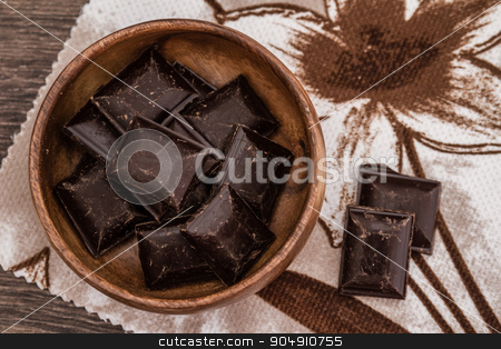 To use this stock image in your creative project, please select the size you need over to the right and click the "Add to Cart" button.
Your downloaded image will come with the Cutcaster watermark removed so don’t worry about the watermark you see on this page. Roughly Cut Chunks of Chocolate Bars in Bowl stock photo, Roughly cut chunks of chocolate bars in a wooden bowl with napkin by OZMedia