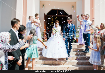 To use this stock image in your creative project, please select the size you need over to the right and click the "Add to Cart" button.
Your downloaded image will come with the Cutcaster watermark removed so don’t worry about the watermark you see on this page. Guests sprinkled rose petals for newlywed after church registr stock photo, Guests sprinkled rose petals for newlywed after church registration by Andrii Shevchuk