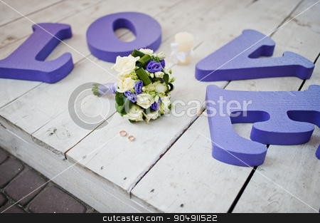To use this stock image in your creative project, please select the size you need over to the right and click the "Add to Cart" button.
Your downloaded image will come with the Cutcaster watermark removed so don’t worry about the watermark you see on this page. Purple decor wedding word love with bouquet and rings stock photo, Purple decor wedding word love with bouquet and rings by Andrii Shevchuk