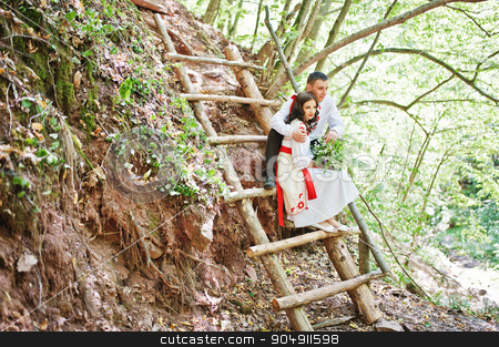 To use this stock image in your creative project, please select the size you need over to the right and click the "Add to Cart" button.
Your downloaded image will come with the Cutcaster watermark removed so don’t worry about the watermark you see on this page. Love story of loving couple in national Ukraine dress. On the wo stock photo, Love story of loving couple in national Ukraine dress. On the wood with rocks by Andrii Shevchuk