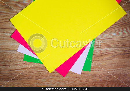 To use this stock image in your creative project, please select the size you need over to the right and click the "Add to Cart" button.
Your downloaded image will come with the Cutcaster watermark removed so don’t worry about the watermark you see on this page. colored sheets of paper stacked on a wooden floor stock photo, colored sheets of paper stacked on a wooden floor. by timonko