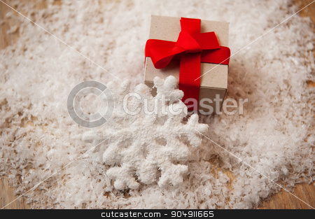 To use this stock image in your creative project, please select the size you need over to the right and click the "Add to Cart" button.
Your downloaded image will come with the Cutcaster watermark removed so don’t worry about the watermark you see on this page. Christmas gift kraft paper and a snowflake in the snow stock photo, Christmas gift kraft paper and a snowflake in the snow. by timonko