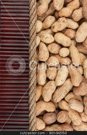 To use this stock image in your creative project, please select the size you need over to the right and click the "Add to Cart" button.
Your downloaded image will come with the Cutcaster watermark removed so don’t worry about the watermark you see on this page. Peanut lying on dark bamboo mat, for menu stock photo, Peanut lying on dark bamboo mat, for menu, can be used as background by alekleks
