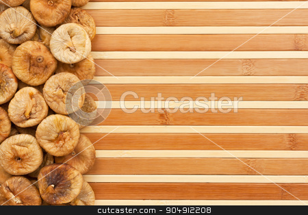 To use this stock image in your creative project, please select the size you need over to the right and click the "Add to Cart" button.
Your downloaded image will come with the Cutcaster watermark removed so don’t worry about the watermark you see on this page. Dried figs lying on a bamboo mat stock photo, Dried figs lying on a bamboo mat as background by alekleks