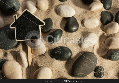 To use this stock image in your creative project, please select the size you need over to the right and click the "Add to Cart" button.
Your downloaded image will come with the Cutcaster watermark removed so don’t worry about the watermark you see on this page. Close-up of stones and house sticking out of the sand in the sun stock photo, Close-up of stones and house sticking out of the sand in the sunlight, with place for your text by alekleks