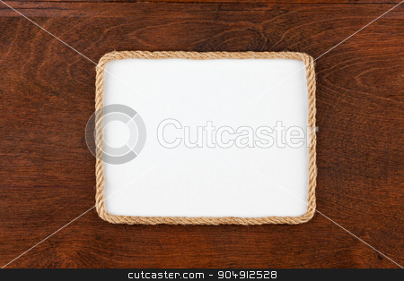 To use this stock image in your creative project, please select the size you need over to the right and click the "Add to Cart" button.
Your downloaded image will come with the Cutcaster watermark removed so don’t worry about the watermark you see on this page. Frame of rope lying on a wooden surface with a white background stock photo, Frame of rope lying on a wooden surface with a white background, for your text by alekleks