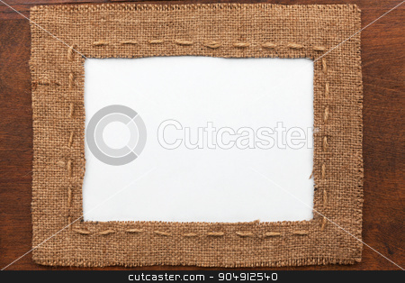To use this stock image in your creative project, please select the size you need over to the right and click the "Add to Cart" button.
Your downloaded image will come with the Cutcaster watermark removed so don’t worry about the watermark you see on this page. Frame made of burlap with white background lying on a wooden sur stock photo, Frame made of burlap with white background lying on a wooden surface, with space for your text by alekleks
