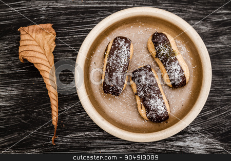 To use this stock image in your creative project, please select the size you need over to the right and click the "Add to Cart" button.
Your downloaded image will come with the Cutcaster watermark removed so don’t worry about the watermark you see on this page. Ekler, Delicious German Dessert, Famous in Turkey stock photo, Ekler, Delicious German Dessert, famous in Turkey in brown plate by OZMedia