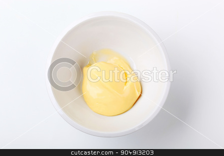 To use this stock image in your creative project, please select the size you need over to the right and click the "Add to Cart" button.
Your downloaded image will come with the Cutcaster watermark removed so don’t worry about the watermark you see on this page. Homemade mayonnaise stock photo, Overhead view of homemade mayonnaise in a bowl by Digifoodstock