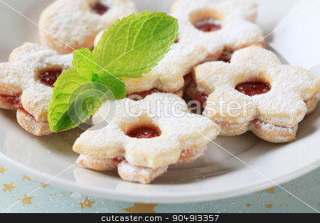 To use this stock image in your creative project, please select the size you need over to the right and click the "Add to Cart" button.
Your downloaded image will come with the Cutcaster watermark removed so don’t worry about the watermark you see on this page. Jam cookies stock photo, Jam filled cookies sprinkled with icing sugar by Digifoodstock