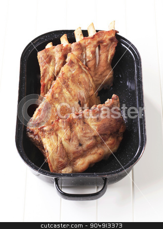 To use this stock image in your creative project, please select the size you need over to the right and click the "Add to Cart" button.
Your downloaded image will come with the Cutcaster watermark removed so don’t worry about the watermark you see on this page. Roast pork ribs stock photo, Oven-roasted rack of pork ribs in a pan by Digifoodstock