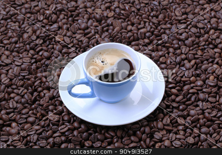To use this stock image in your creative project, please select the size you need over to the right and click the "Add to Cart" button.
Your downloaded image will come with the Cutcaster watermark removed so don’t worry about the watermark you see on this page. Cup of coffee stock photo, Cup of black coffee on a bed of coffee beans by Digifoodstock