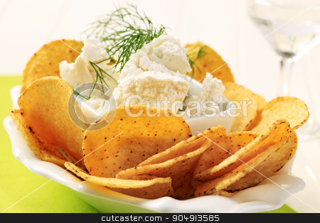 To use this stock image in your creative project, please select the size you need over to the right and click the "Add to Cart" button.
Your downloaded image will come with the Cutcaster watermark removed so don’t worry about the watermark you see on this page. Corn chips with cheese stock photo, Bowl of tortilla chips and curd cheese by Digifoodstock