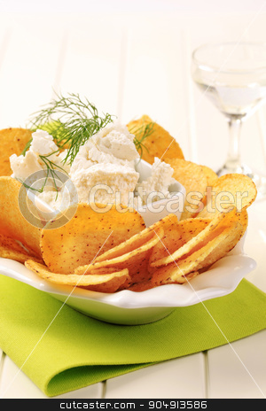 To use this stock image in your creative project, please select the size you need over to the right and click the "Add to Cart" button.
Your downloaded image will come with the Cutcaster watermark removed so don’t worry about the watermark you see on this page. Corn chips with cheese stock photo, Bowl of tortilla chips and curd cheese by Digifoodstock
