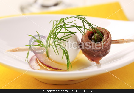 To use this stock image in your creative project, please select the size you need over to the right and click the "Add to Cart" button.
Your downloaded image will come with the Cutcaster watermark removed so don’t worry about the watermark you see on this page. Bite-sized hors d'oeuvre stock photo, Mozzarella cheese and rolled anchovy on a stick by Digifoodstock