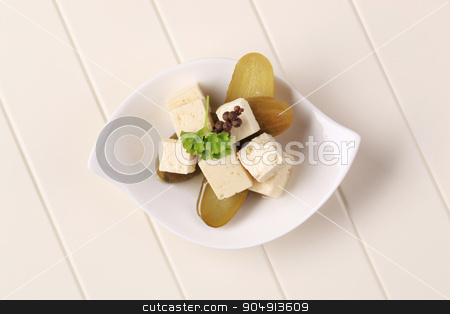 To use this stock image in your creative project, please select the size you need over to the right and click the "Add to Cart" button.
Your downloaded image will come with the Cutcaster watermark removed so don’t worry about the watermark you see on this page. Feta cheese and pickles stock photo, Cubes of marinated feta cheese and pickles by Digifoodstock