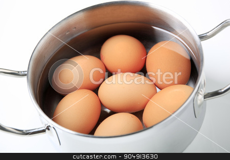 To use this stock image in your creative project, please select the size you need over to the right and click the "Add to Cart" button.
Your downloaded image will come with the Cutcaster watermark removed so don’t worry about the watermark you see on this page. Eggs in a saucepan stock photo, Brown eggs in water in a metal pot by Digifoodstock