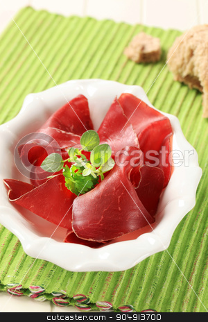 To use this stock image in your creative project, please select the size you need over to the right and click the "Add to Cart" button.
Your downloaded image will come with the Cutcaster watermark removed so don’t worry about the watermark you see on this page. Dried meat stock photo, Thin slices of dried meat in a bowl by Digifoodstock