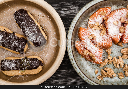 To use this stock image in your creative project, please select the size you need over to the right and click the "Add to Cart" button.
Your downloaded image will come with the Cutcaster watermark removed so don’t worry about the watermark you see on this page. Delicious Traditional Turkish Pumpkin and German Dessert stock photo, Delicious traditional Turkish pumpkin and German dessert on dark background by OZMedia
