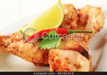 To use this stock image in your creative project, please select the size you need over to the right and click the "Add to Cart" button.
Your downloaded image will come with the Cutcaster watermark removed so don’t worry about the watermark you see on this page. Spicy chicken drumsticks stock photo, Spicy chicken drumsticks with crispy skin - detail by Digifoodstock