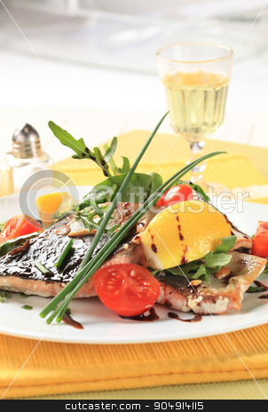 To use this stock image in your creative project, please select the size you need over to the right and click the "Add to Cart" button.
Your downloaded image will come with the Cutcaster watermark removed so don’t worry about the watermark you see on this page. Fish fillet with salad greens and tomatoes stock photo, Portioned fish fillet on bed of salad greens drizzled with balsamic sauce by Digifoodstock